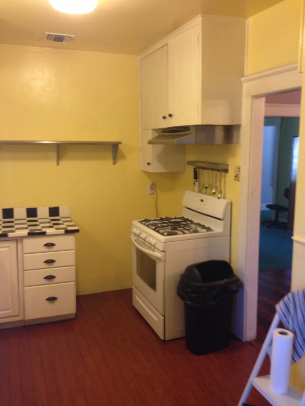 Kitchen - Notice all of the unused space in between the stove and the counter top.