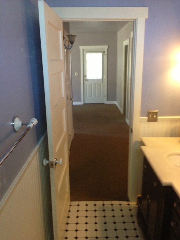 Master Bathroom - looking out into the family room. Why isn't it connected to the master bedroom?