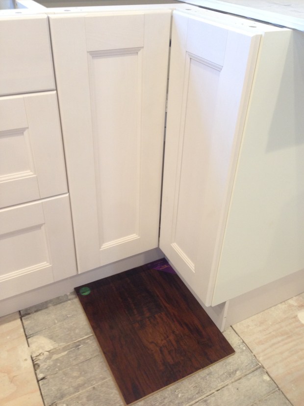 Sample of the wood we chose next to the kitchen cabinets. 