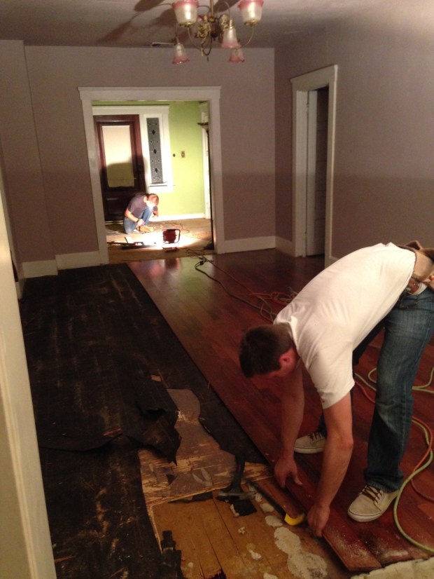 Kevin removing the wood floor. 