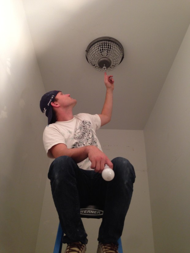 Removed the plywood shelving in the master closet and installed this beautiful light!