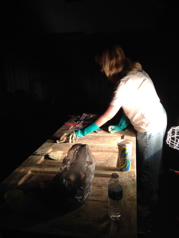 My mom working into the night, stripping the paint off that door.