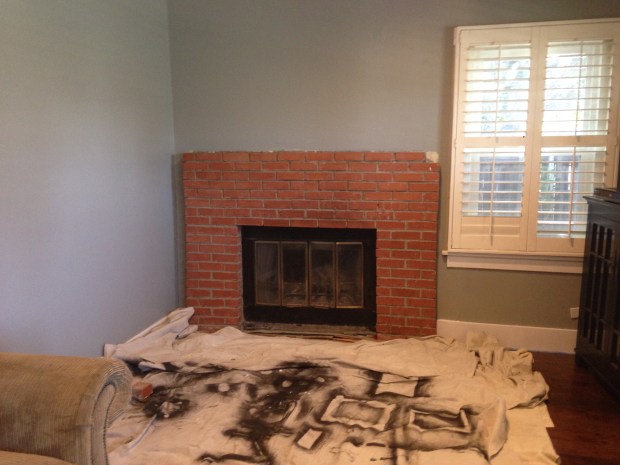 Faulty brick fireplace with no hearth.