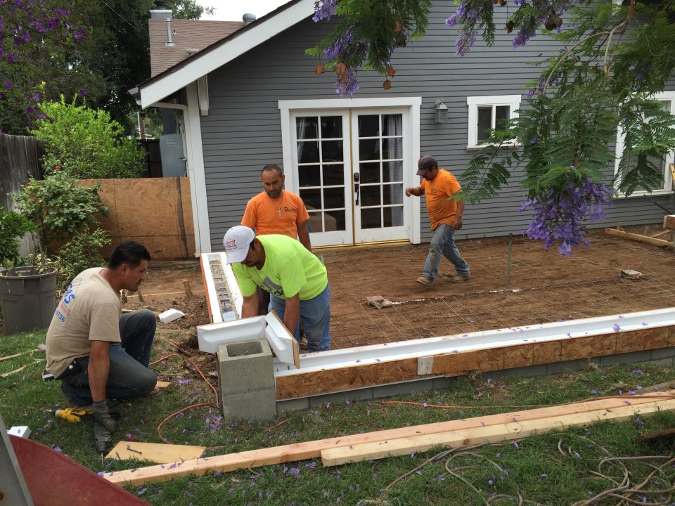 Preparing the molds for the rounded edges of the seat wall.