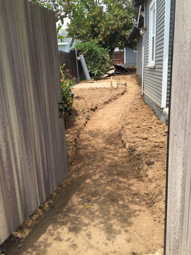 Path dug out, ready for concrete stones to be laid.